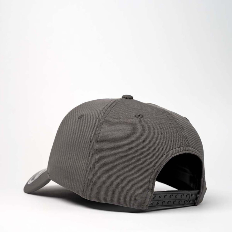 A grey recycled cap with a curved brim, featuring an adjustable strap and a logo on the side.