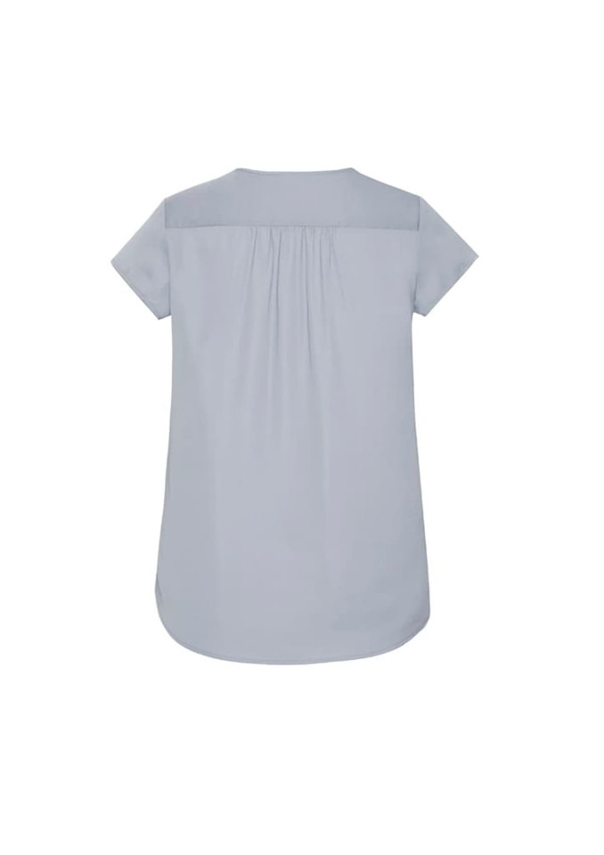 A light blue women's blouse featuring a V-neck and pleat detailing at the back. Includes a logo.