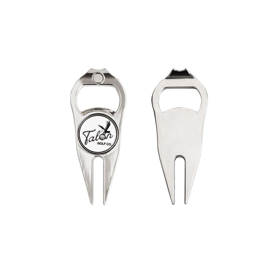 A golf divot tool featuring a ball marker and bottle opener in metallic silver with a logo.