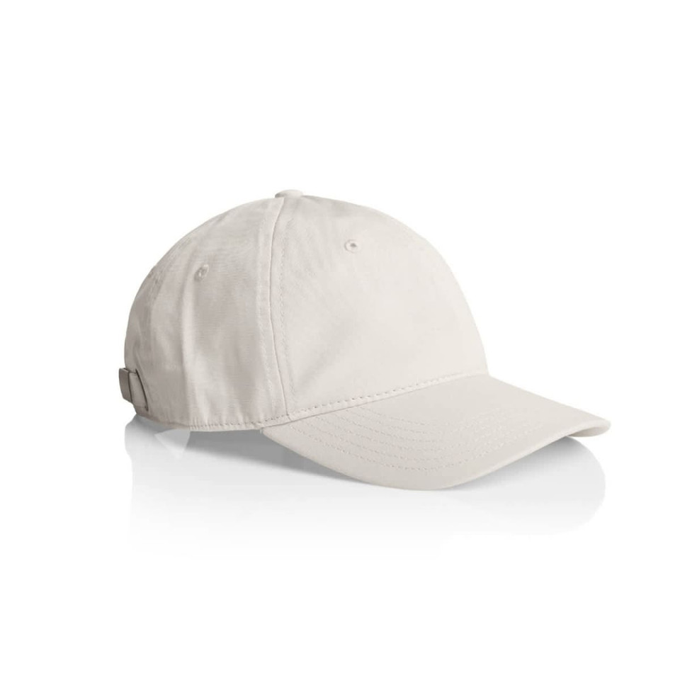 A light-coloured cap with a curved peak and a strap at the back, featuring a logo.