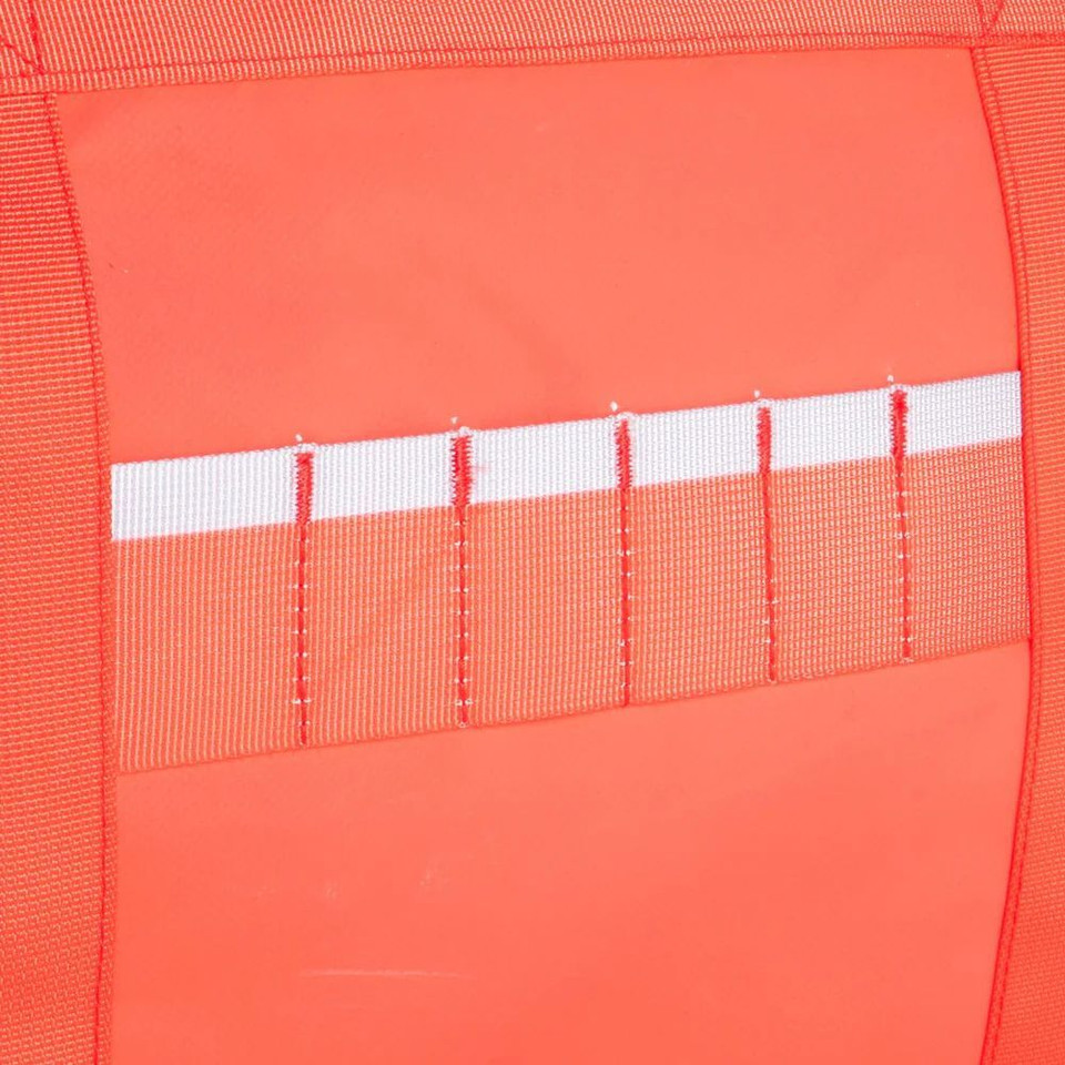 Red fabric with white stripe and stitching detail close-up, part of a red rugged xtremes crew bag