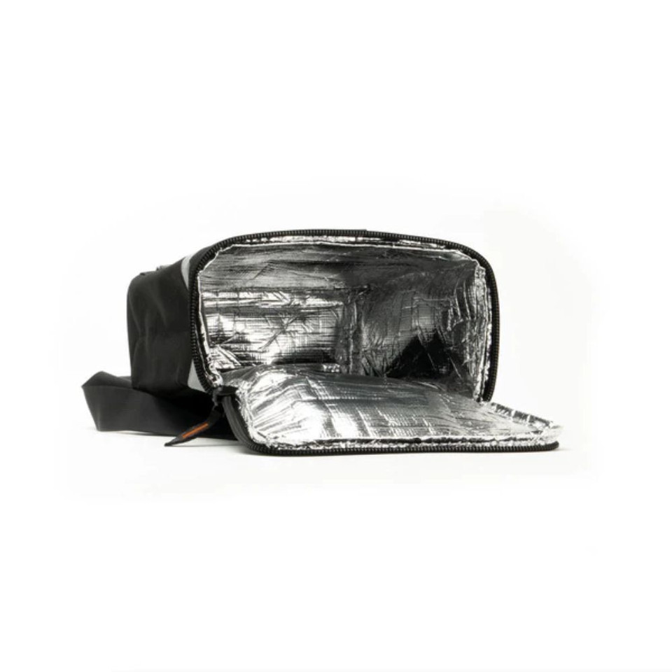 Insulated black cooler bag opened, showing reflective lining.