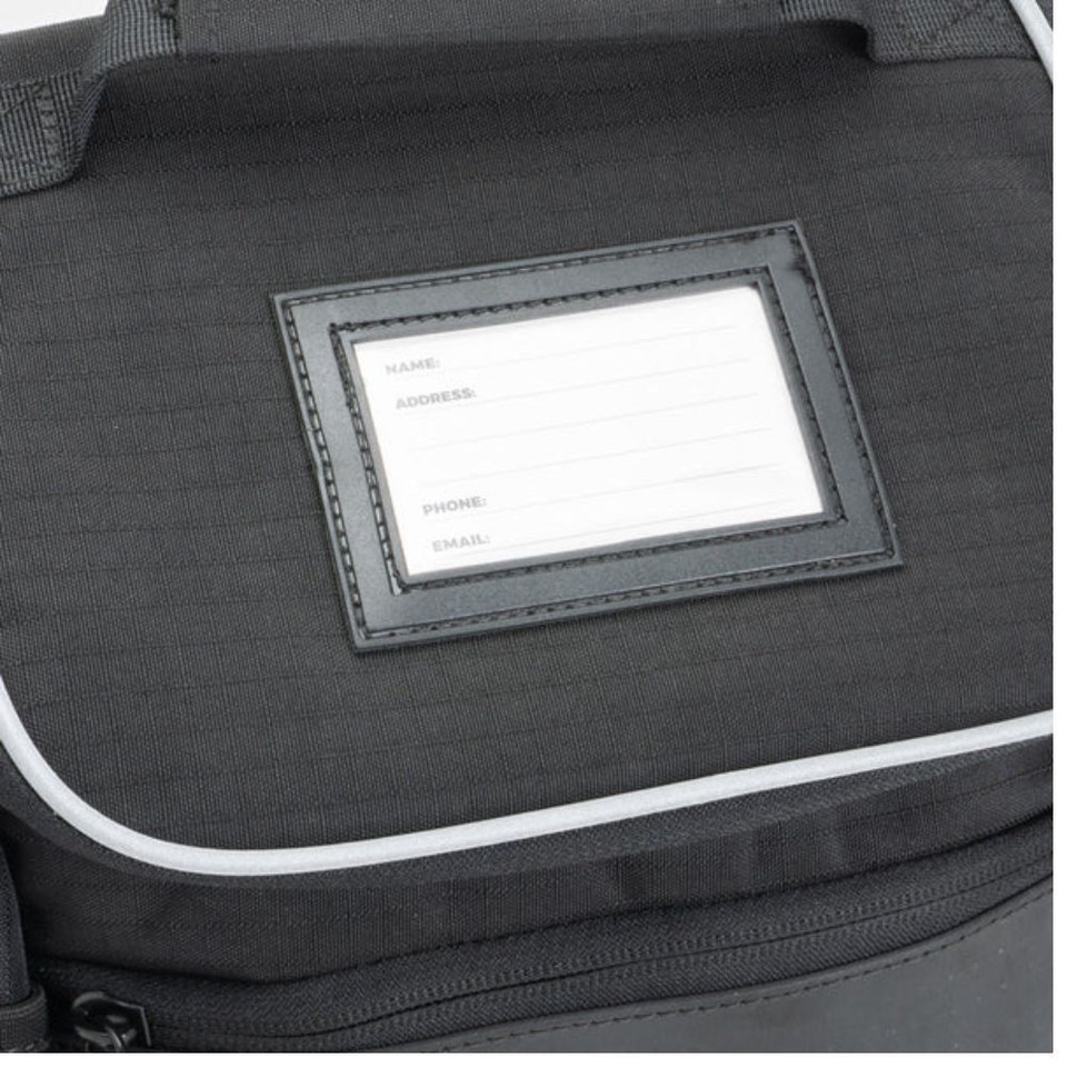 Black cooler bag with visible name and address card holder on the flap.
