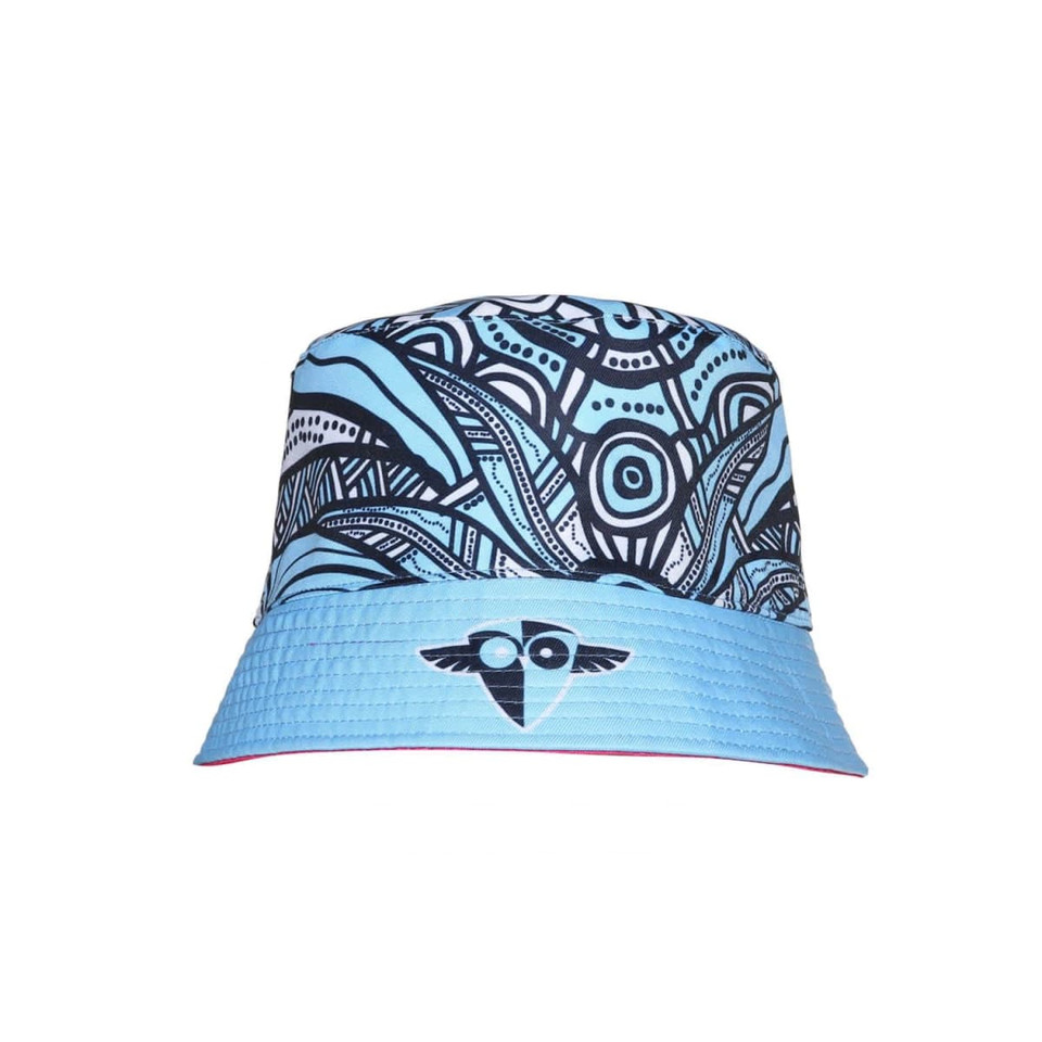 A reversible bucket hat featuring a blue and black abstract design, with a logo on the front.