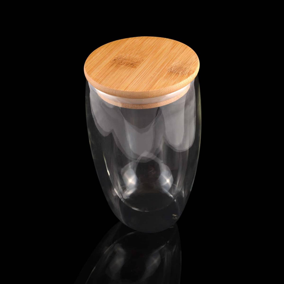 A drink bottle with a clear glass body and a natural bamboo lid, designed for stylish beverage storage.