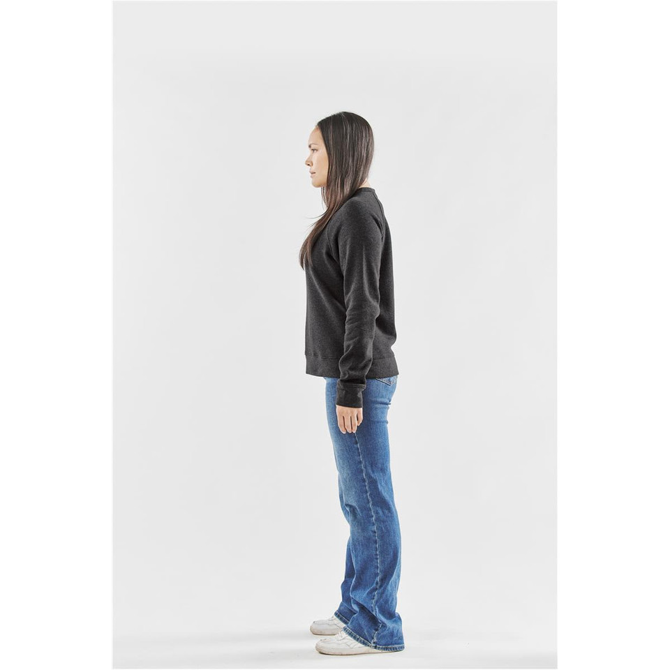 A model wearing a black Women's Monashee Fleece Crew Neck jumper in profile against a white background.