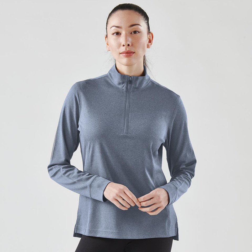 A women's blue 1/4 zip pullover jumper with long sleeves, featuring a subtle texture and a branding logo.