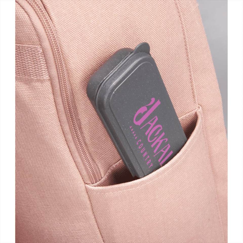 A grey cutlery case with a pink logo tucked into a light pink bag pocket.