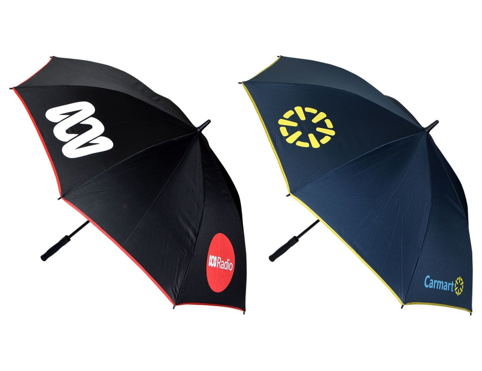 A promotional umbrella featuring a black side with logos and a navy side with a logo, equipped with a black handle.