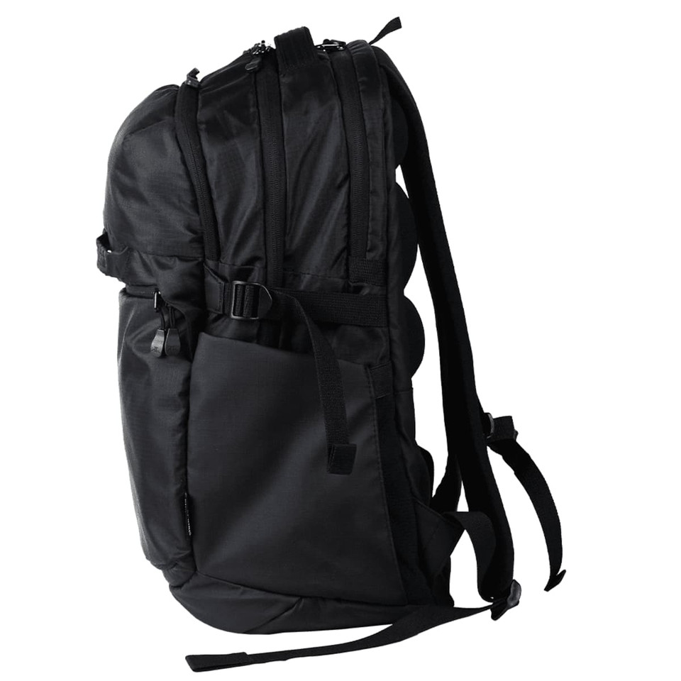 A black computer backpack with multiple compartments, straps, and a sleek design. It has a logo on the front.