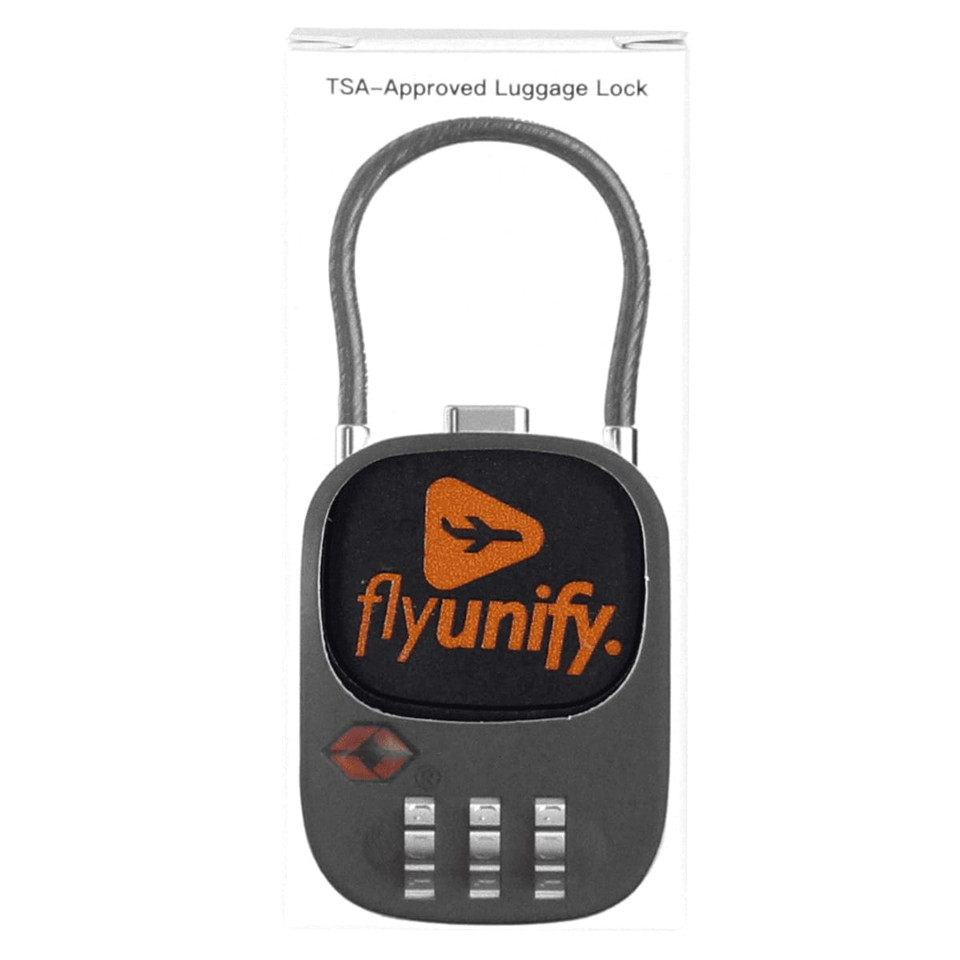 A TSA-approved luggage lock in black with a combination dial and an orange logo.
