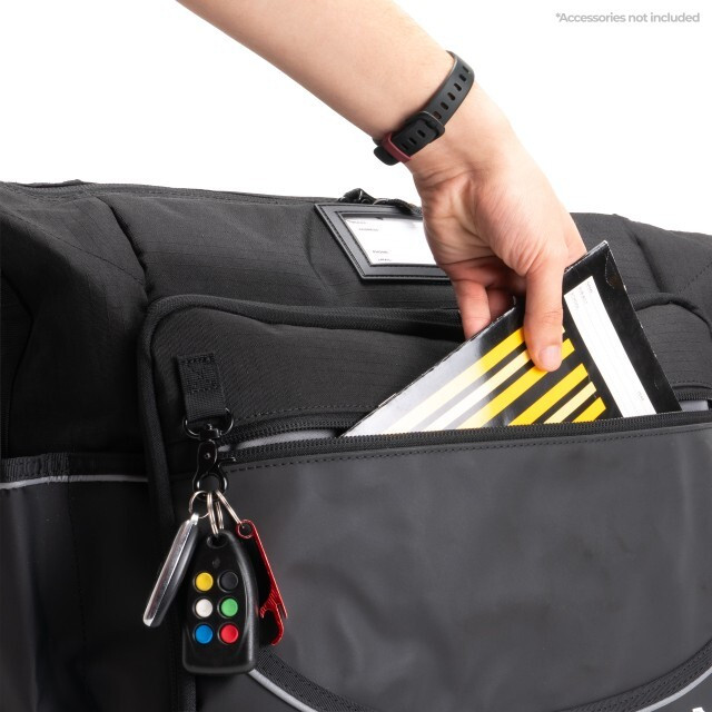 Open utility organizer with various compartments, showcasing accessories and a notebook for efficient storage solutions.
