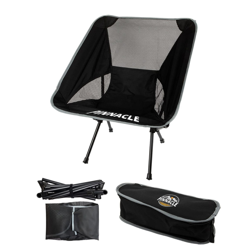 A black folding chair with a mesh seat and grey accents, accompanied by its carrying bag and assembled frame.