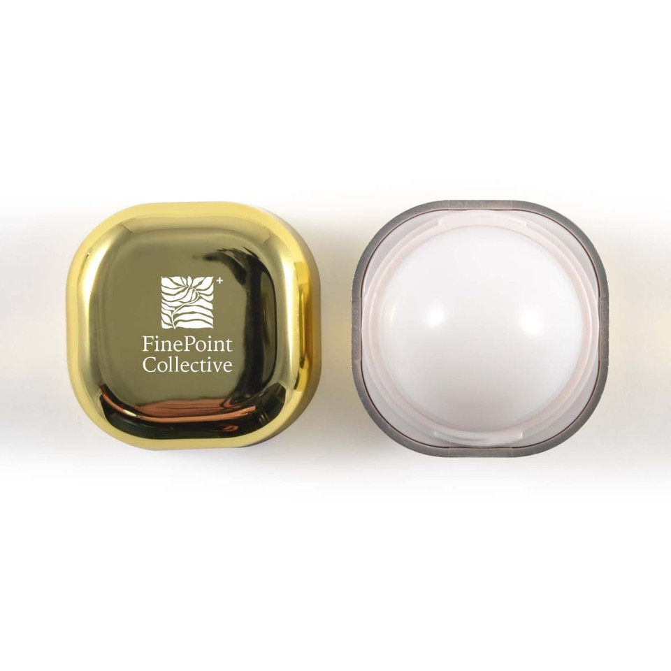 A gold and clear cosmetic jar with a logo on the lid, featuring a smooth, white interior.