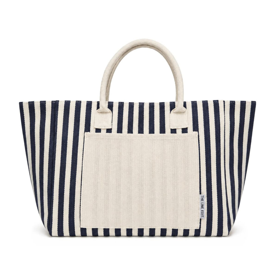 A navy and cream striped tote bag with two sturdy handles and a front pocket. It features a branding logo.