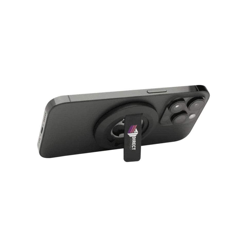 A magnetic phone stand in black, featuring a bottle opener and a logo, mounted on the back of a smartphone.