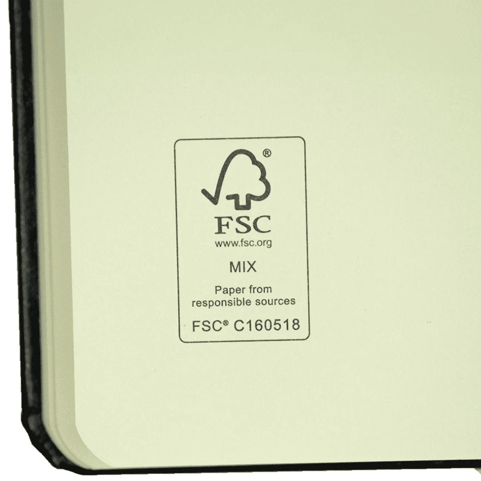 A bound journal with a black cover and cream-coloured pages, featuring an FSC certification logo.