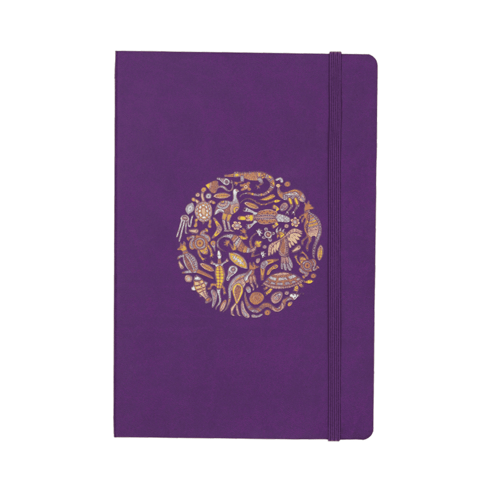 A purple bound journal featuring a decorative circular design and an elastic band closure.