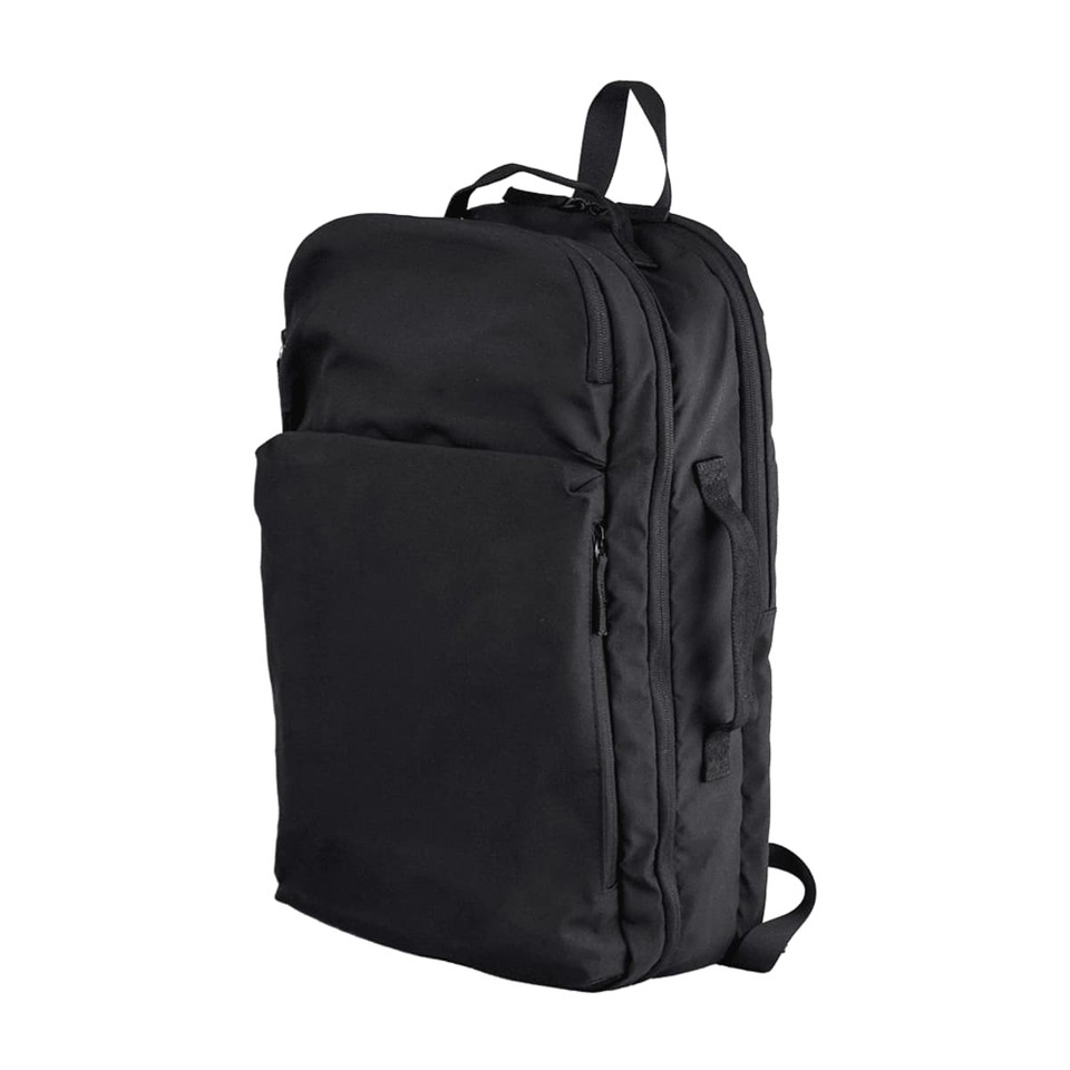 A black backpack with multiple compartments and a logo, featuring a sleek, minimalist design.