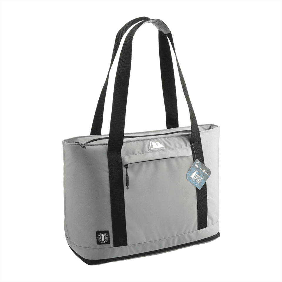 A grey cooler bag with black straps and a zipped top, featuring a logo and a tag.