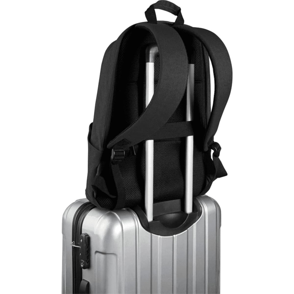 A black laptop backpack with padded straps sitting on top of a silver suitcase. The backpack features a logo.