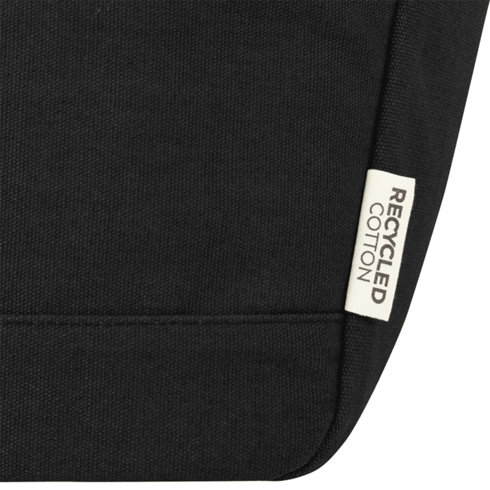 A black cooler tote featuring a recycled cotton label and a simple, sleek design.