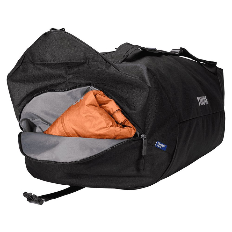A black duffel bag with a mid blue accent, featuring a large opening and an orange interior. The bag has a logo.