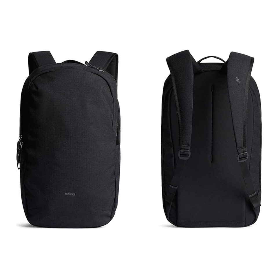 A black backpack with adjustable straps and a sleek design, featuring a logo and multiple zippered compartments.