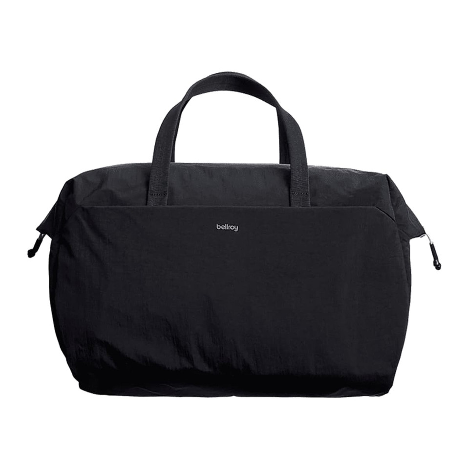 A black duffel bag with two handles and a zip closure, featuring a subtle logo on the front.