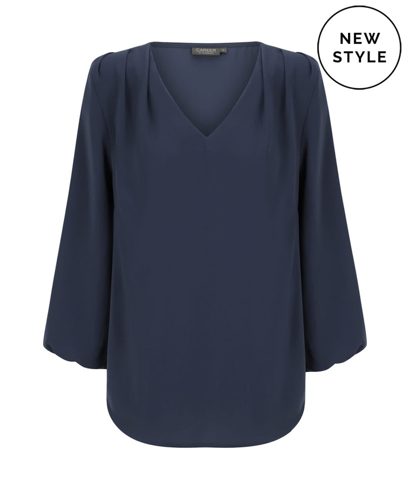 A navy blue V-neck popover shirt with long sleeves and pleated detailing. It features a logo in the corner.