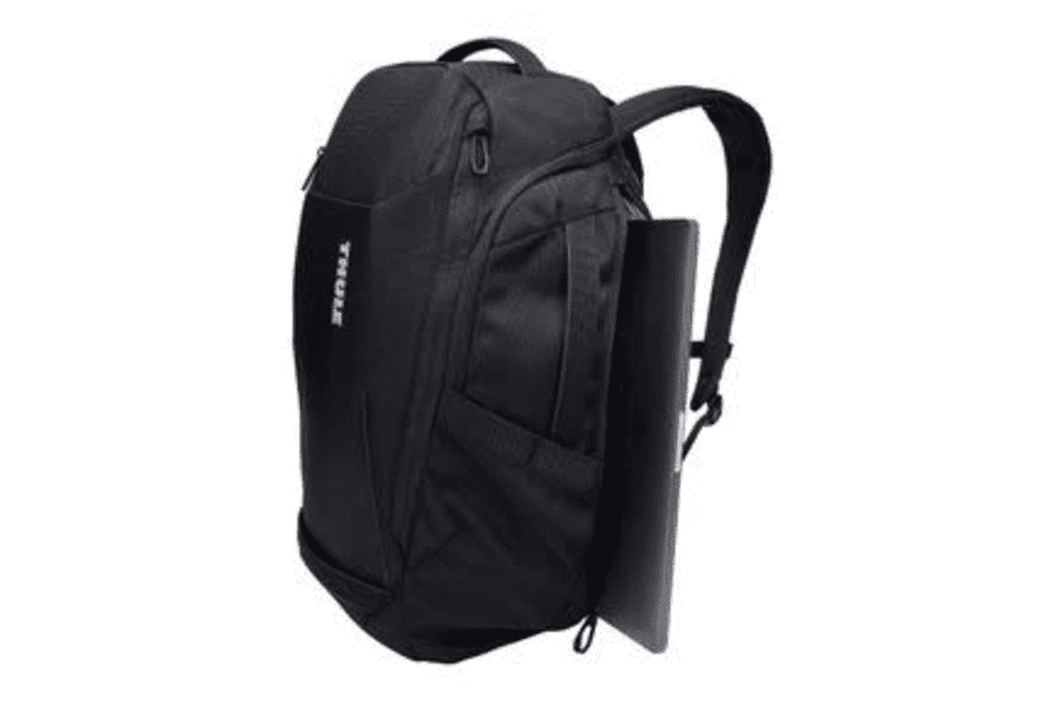 A black backpack with a sleek design, featuring a side pocket for a laptop and a logo.