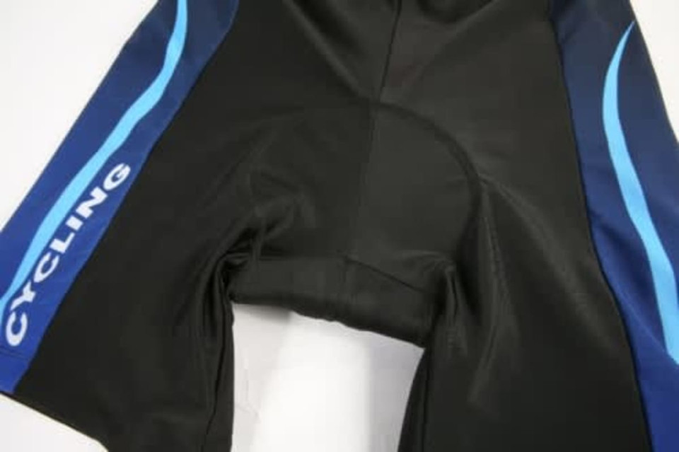 A pair of cycling shorts in black with blue accents and a logo, designed for sports team wear.