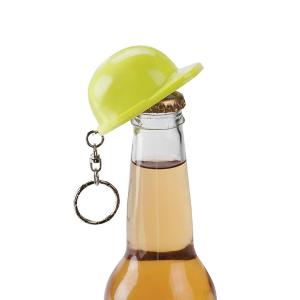 A bright yellow hard hat keyring sits atop a bottle, featuring a metal keyring attachment.