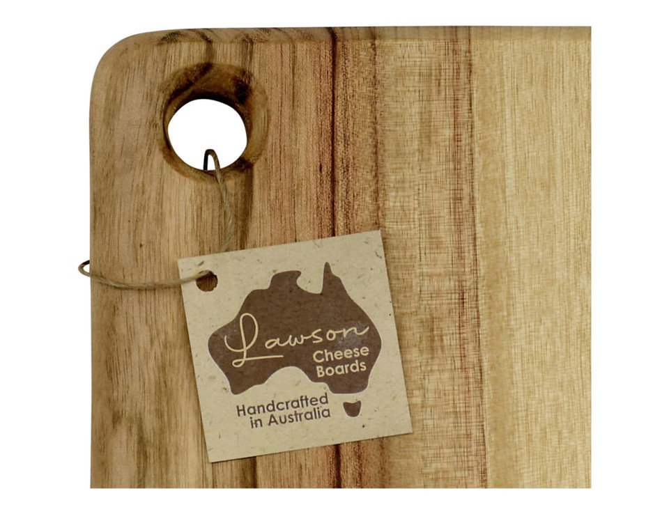 A wooden cheese board with a hole for hanging, featuring a natural finish and a tag with a logo.