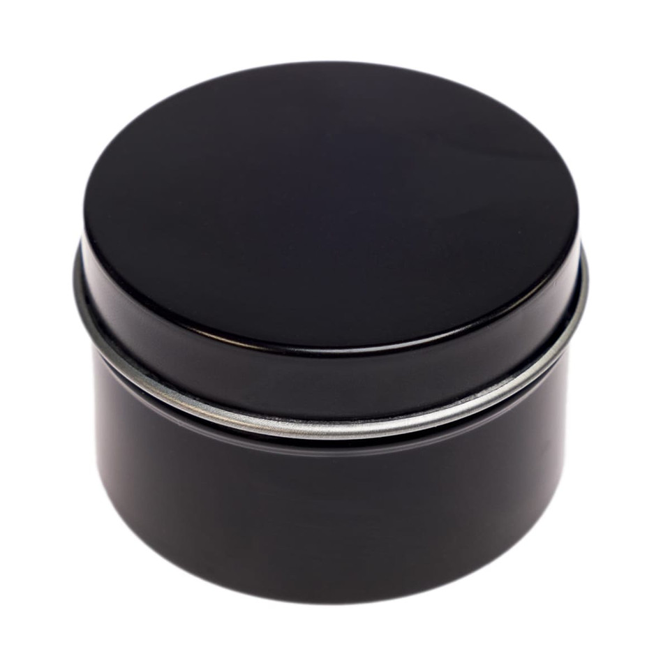 A black tin candle container with a smooth, rounded lid, designed for holding a petite candle.