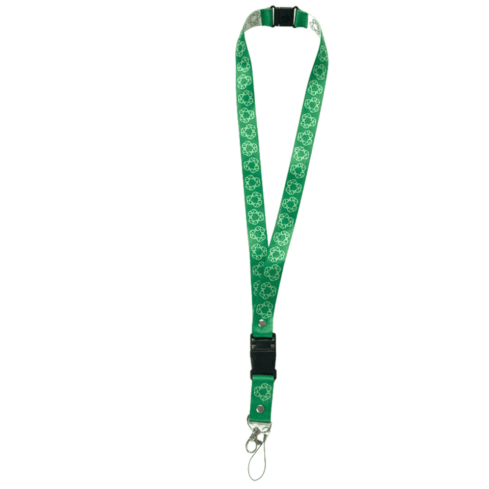 A green rPET USB sublimated lanyard featuring a floral pattern and a metal clip for attachments.