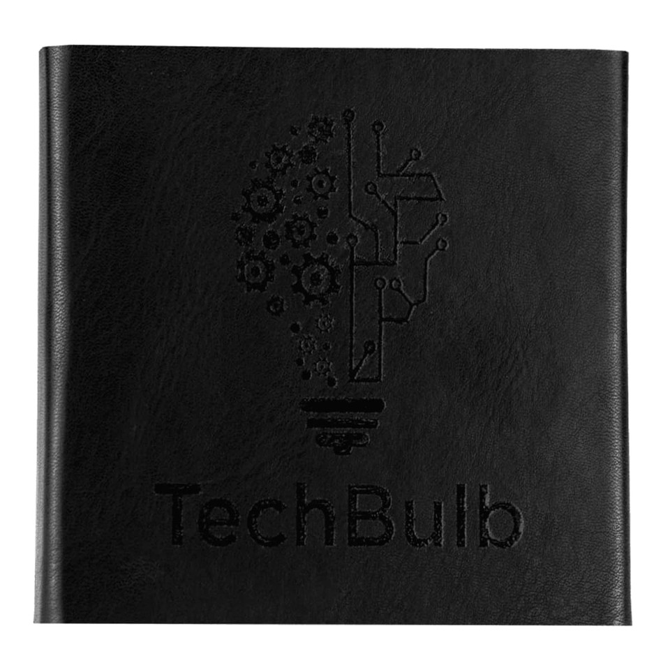 A black notebook with an embossed design of a light bulb and gears, featuring the brand name TechBulb.