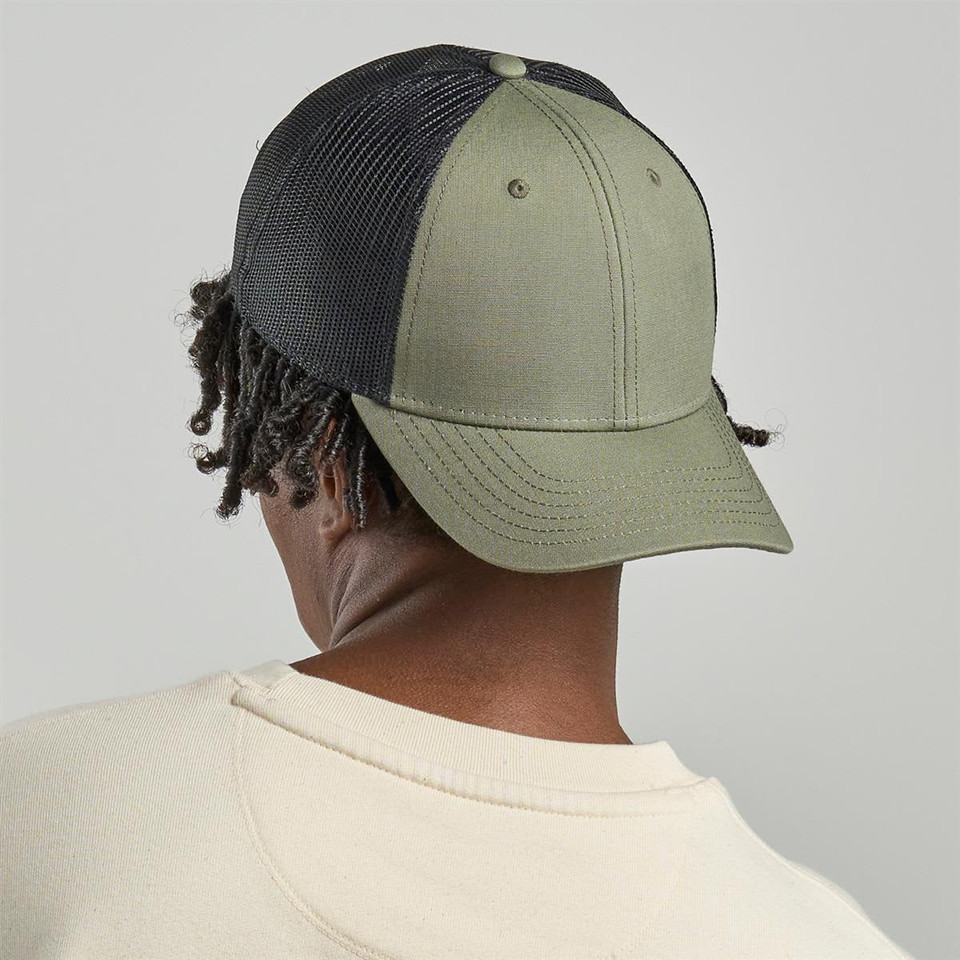 A cap featuring an olive green front and black mesh back, complete with a structured brim and a logo.