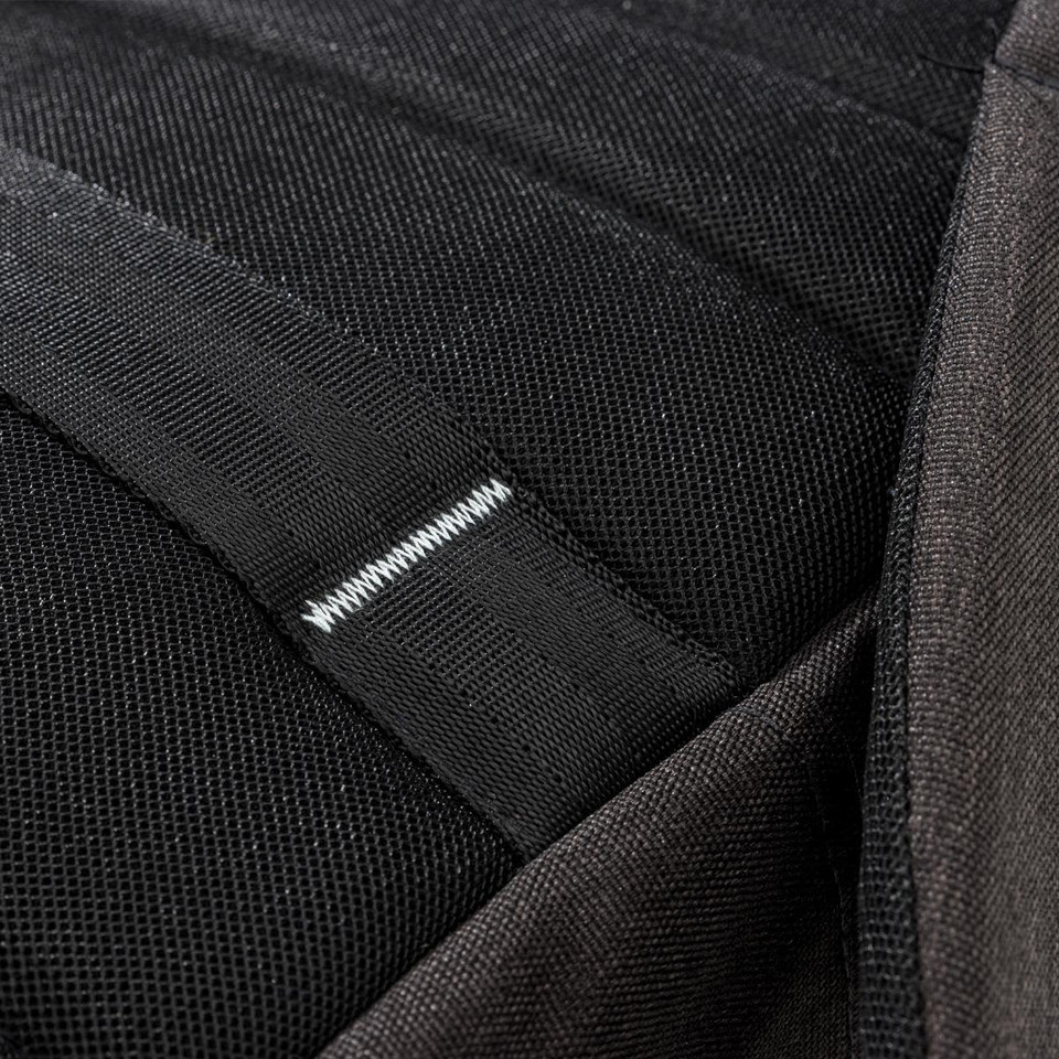 Detailed close-up of a Swissdigital Arosa Backpack featuring black mesh fabric and stitching elements.
