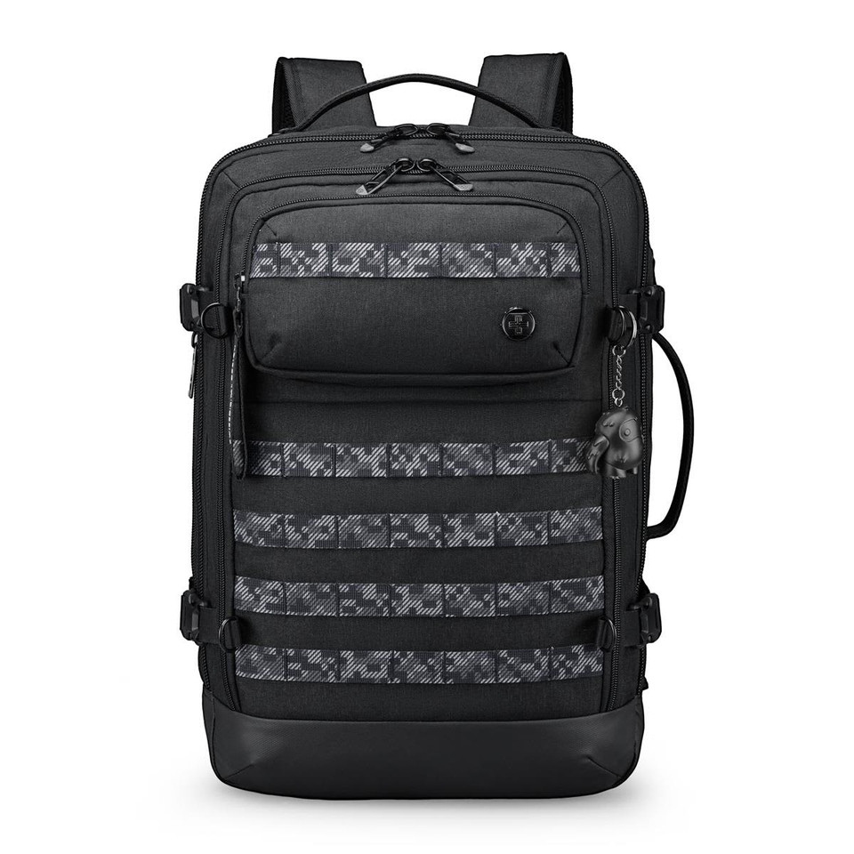A black backpack with a patterned front panel and multiple pockets. It features adjustable straps and a logo.