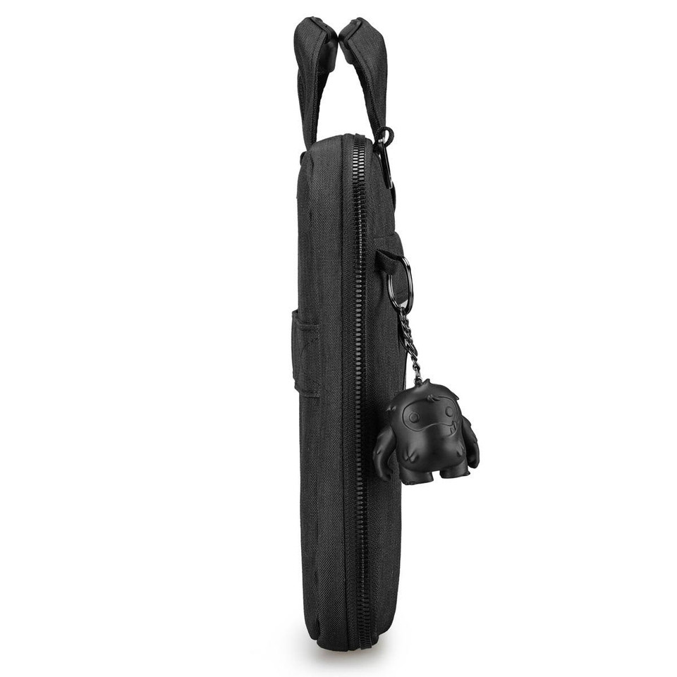 A black laptop sleeve with a zipper, featuring a charm attached to the side. It has two top handles for carrying.