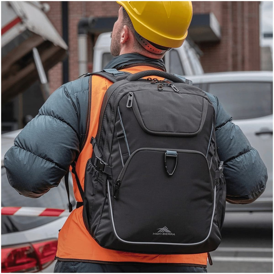 A sturdy, black High Sierra Access 4.0 backpack, worn by a worker in an orange vest and hard hat.