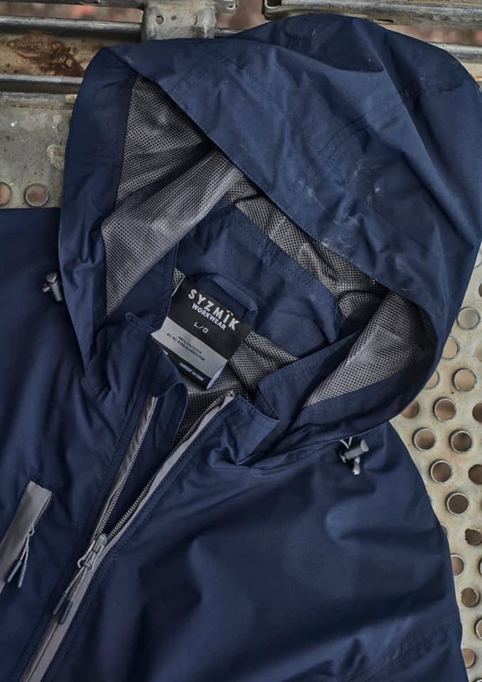 A navy unisex packable rain jacket featuring a hood, mesh lining, and a label. It includes a branding logo.