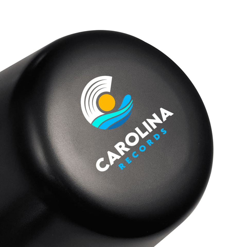 A black lamp with a rounded top featuring a logo design. The lamp is compact and rechargeable.