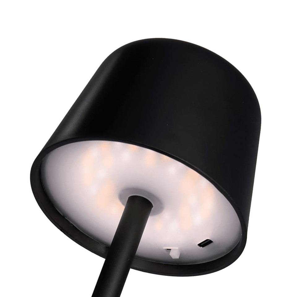 A black mini rechargeable lamp featuring a cylindrical shade and a circular light base, with a charging port visible.