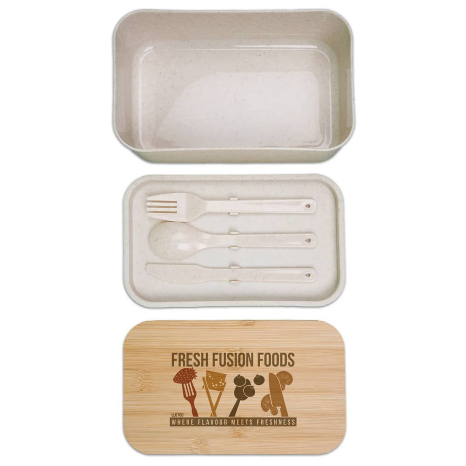 A beige lunch box with a bamboo lid, containing utensils including a fork and spoon. It features a logo.