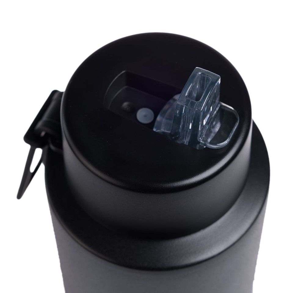 A drink bottle with a sleek black design and a transparent opening mechanism on top. It features a logo.