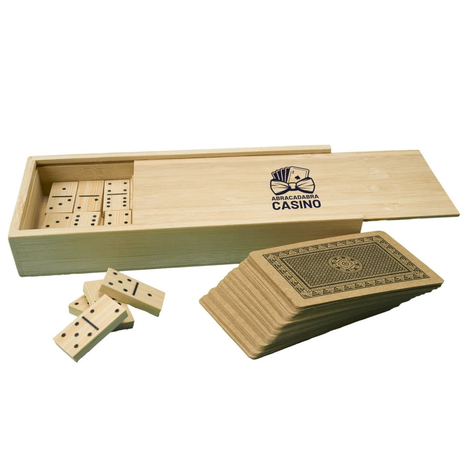 A bamboo box containing a set of wooden dominoes and a deck of cards, featuring a logo on the box.