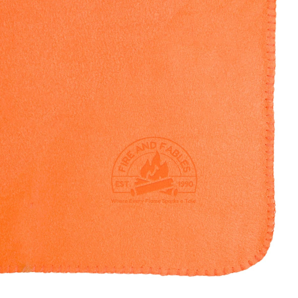 An orange fleece blanket featuring a logo in the corner. The fabric appears soft and warm.