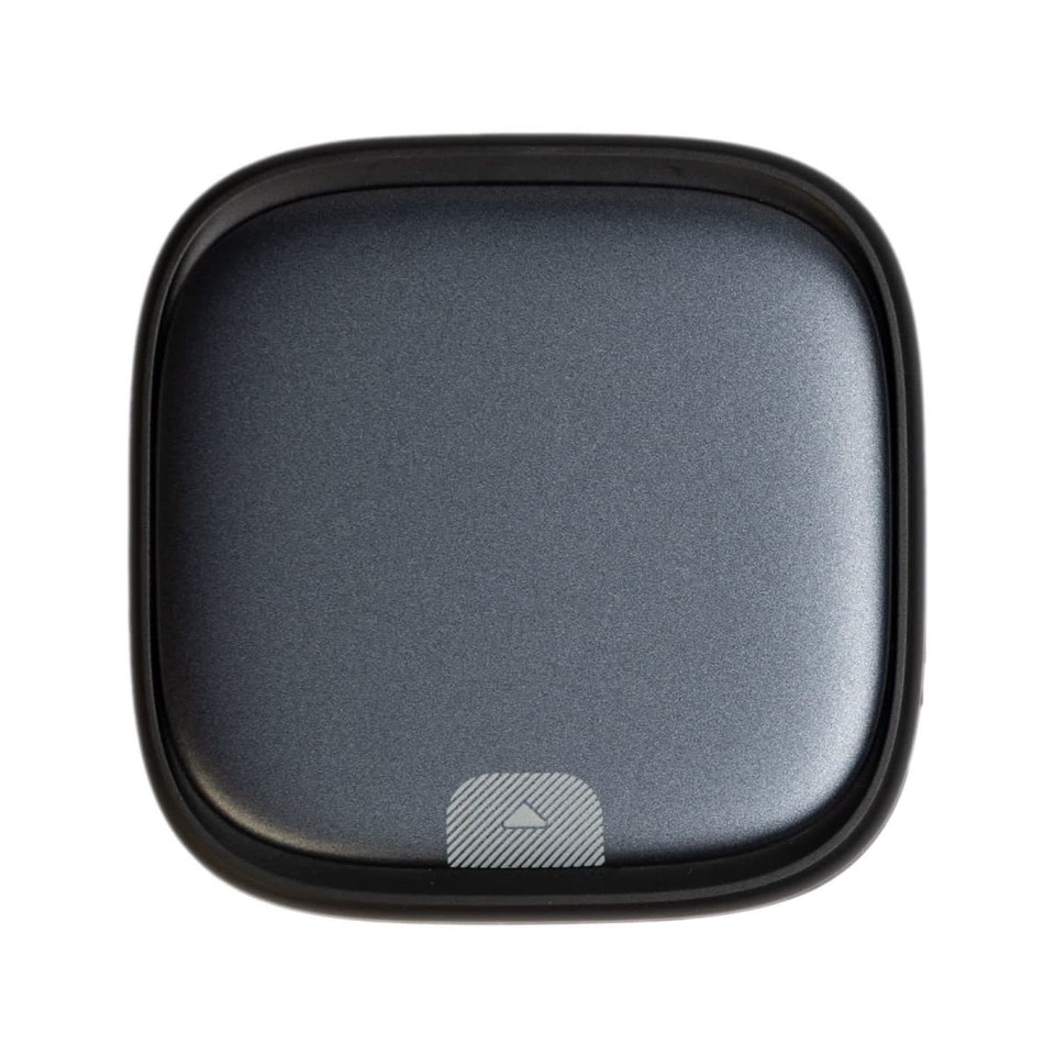 A grey retractable cable set in a sleek, square case, featuring a logo on the front.